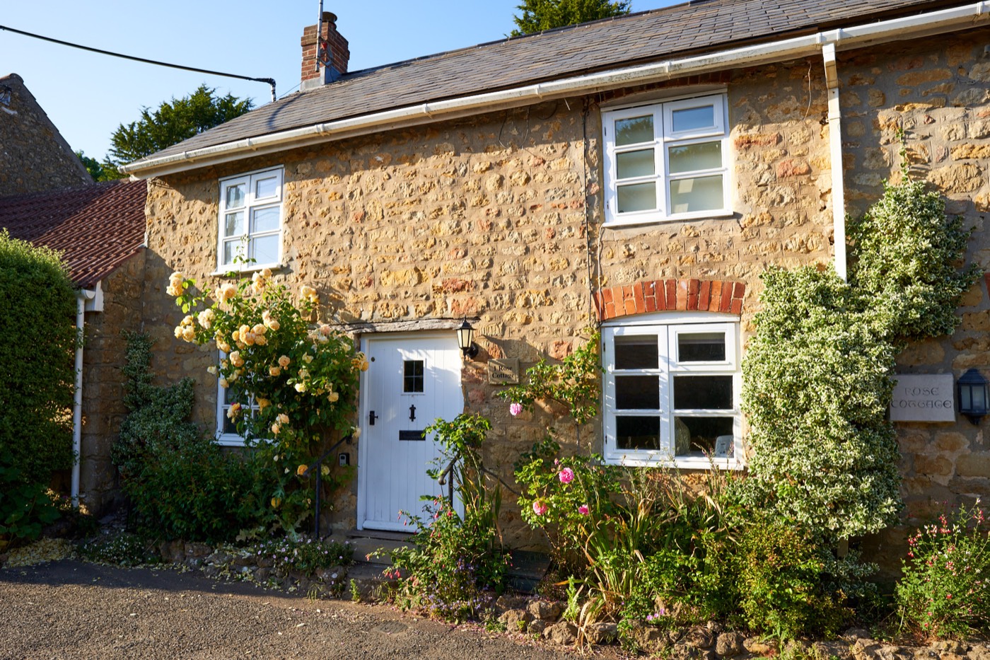 A heritage stone cottage landscape in soft afternoon light